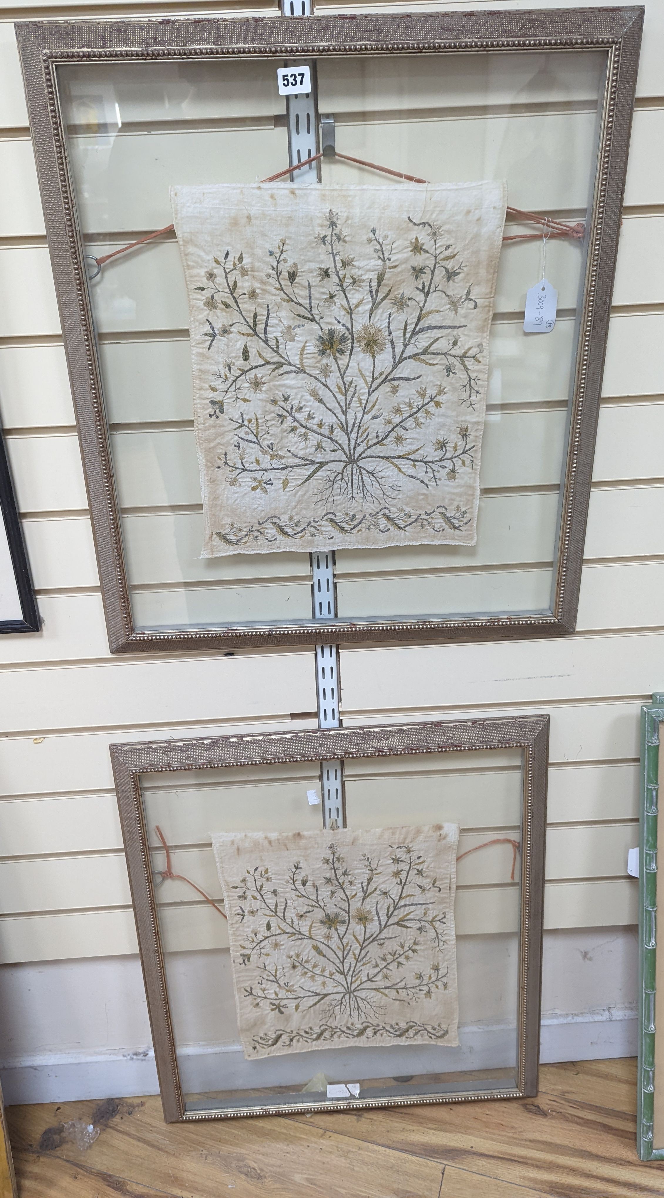 A pair of framed, silver and gold thread floral embroidered Turkish towel ends, 39 x 35cm excl. frame.